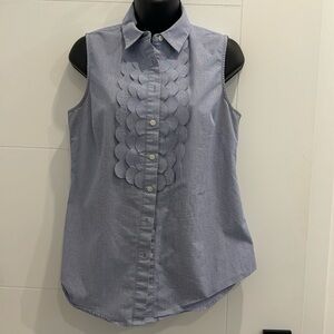 Blue sleeveless Riley shirt.